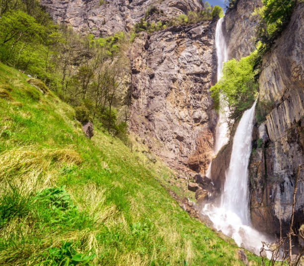 Landscape with two of the waterfalls that form the Seerenbach cascade, which flows from the Alps mountains and is located near the Amden municipality, Switzerland.