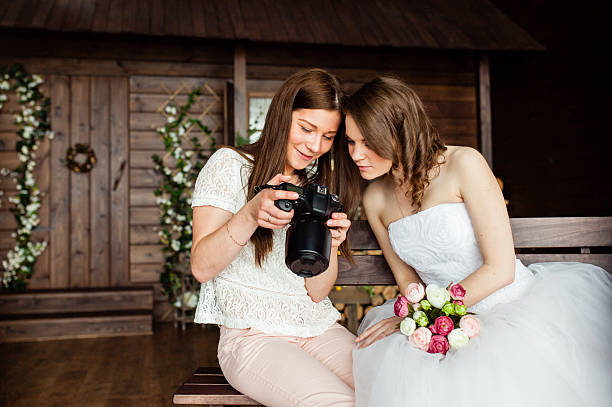 Photographer shows the bride had just taken photos stock photo