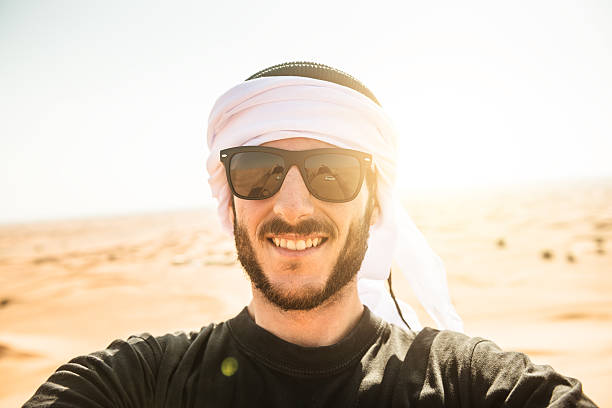 istock tourist man doing a selfie on the desert 540388038