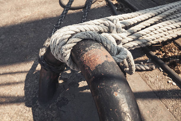 istock White nautical ropes and mooring ring, closeup 540388110