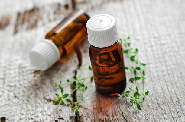 istock Two small bottles of essential thyme oil 540389694