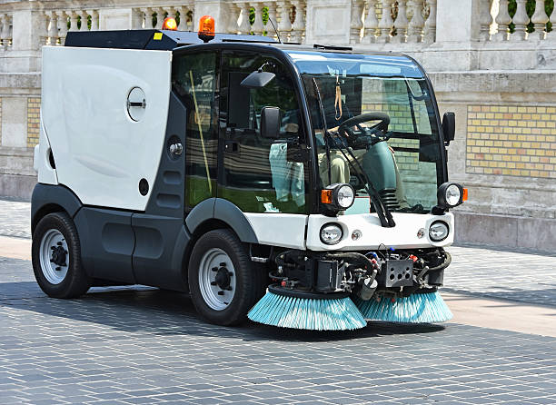 Street cleaner vehicle at work Street cleaner vehicle at work in the city street sweeper stock pictures, royalty-free photos & images