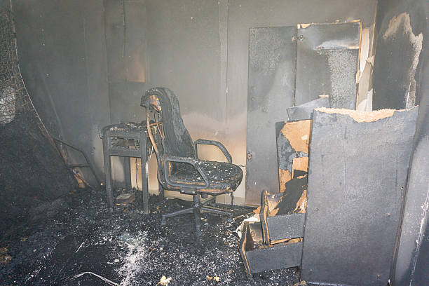 chair and furniture in room after burned stock photo