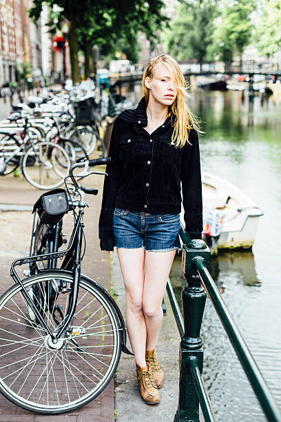 istock Woman with bike 540391764