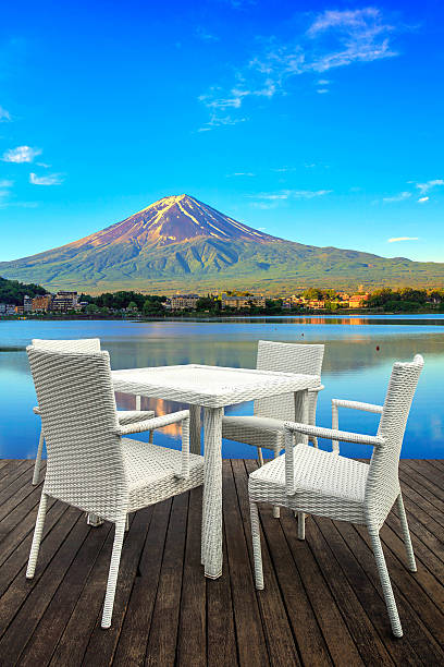 istock White dining table on lake and mountain background 540393778