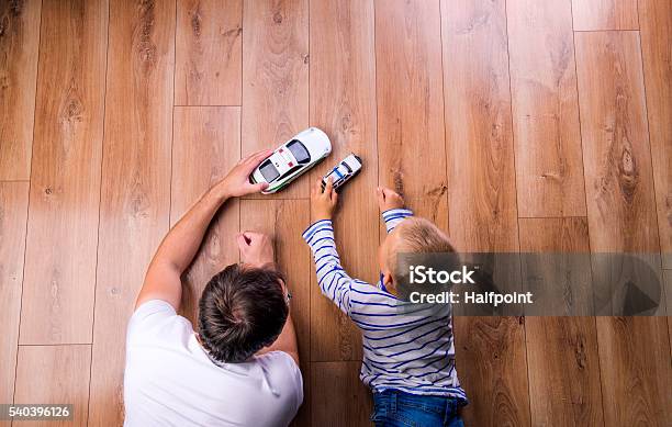 Unrecognizable Father With His Son Playing With Cars Stock Photo - Download Image Now