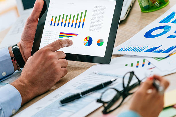 istock Teamwork with two business people in office with business analysis 540396766
