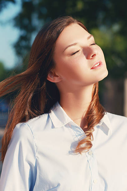istock woman enjoys sun 540396894
