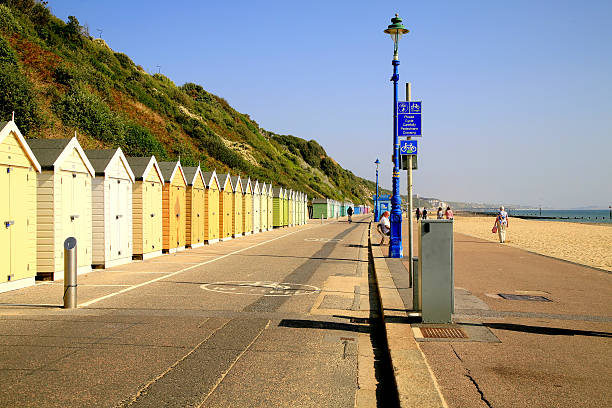 Bournemouth Promenade. Bournemouth, Dorset, UK. September 30, 2014. The promenade and a row of beach huts below the cliffs looking towards Boscombe in September. boscombe photos stock pictures, royalty-free photos & images