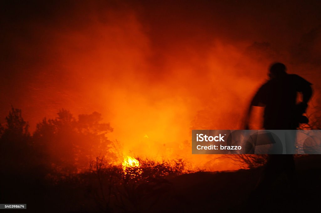Fire But Not Raging Fire Fireman Runs Towards Raging Bush Fire Stock Photo - Download Image Now ...