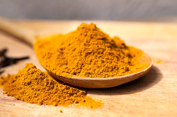 istock Indian spices on the wooden spoon 540401072