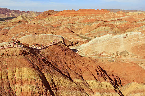 istock some tourists stand on the boardwalk over the Danxia Landform 540401426