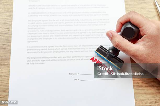 Approved The Contract Documents With Rubber Stamp Stock Photo - Download Image Now - Endorsing, Rubber Stamp, Agreement