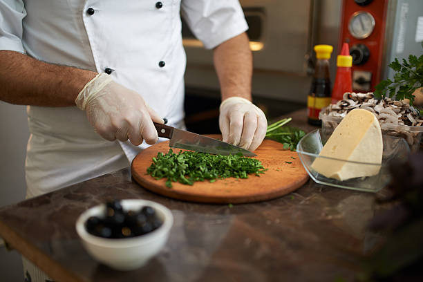 istock chopped green on the board with  knife 540404750