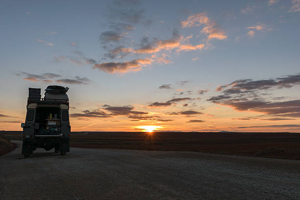 Off-road vehicle oldtimer sunset stock photo