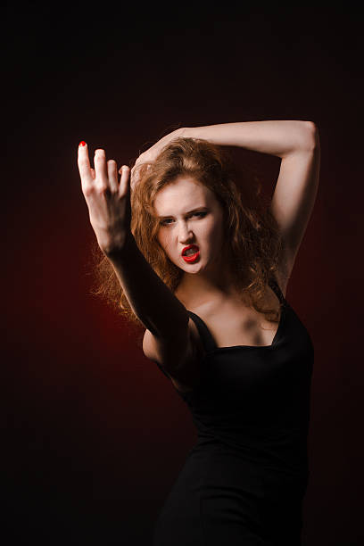istock mysterious sexy girl with red lips 540407626