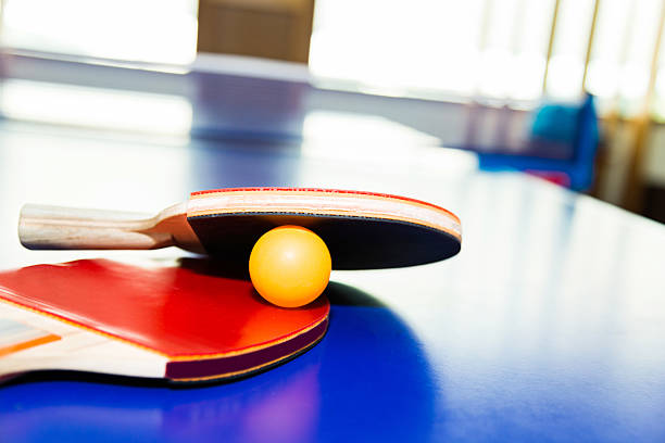 istock Ping-Pong paddles with ball on table 540408692