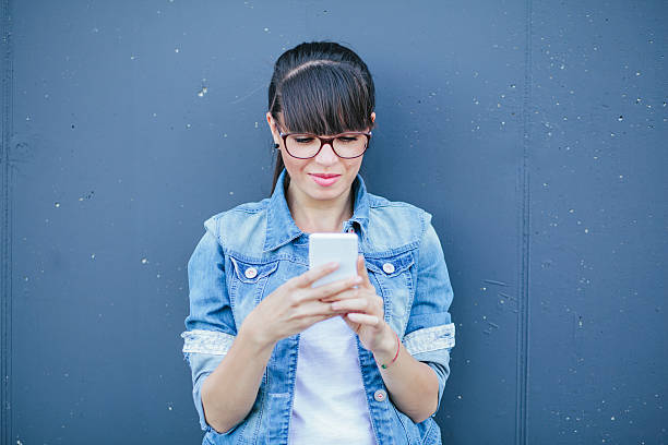 istock Beautiful woman using her smartphone, outdoors 540408774