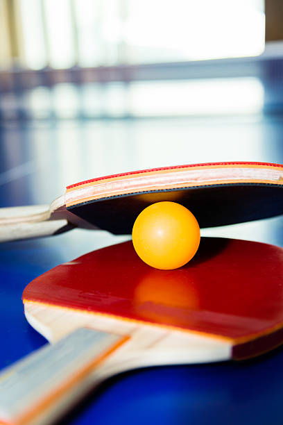 istock Ping-Pong paddles with ball on table 540408832