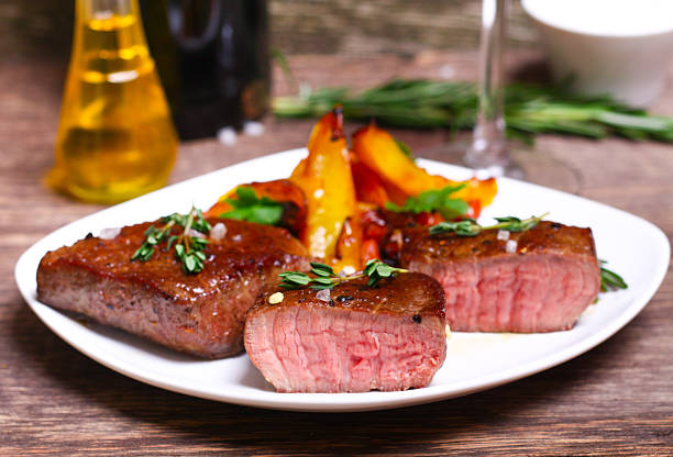 istock medium roast rib-eye steak with pepper, thyme and salt 540409130
