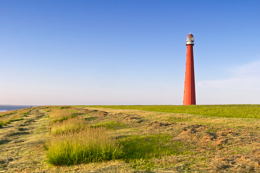 Lighthouse Lange Jaap unde a blue sky in Den Helder, The Netherlands.