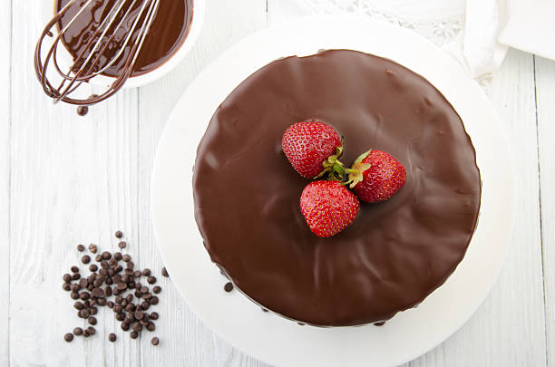istock The process of making chocolate Cake filled with glazeTop view. 540487568