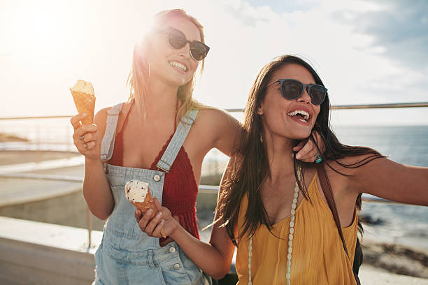 istock Two female friends enjoying ice cream together 540488084