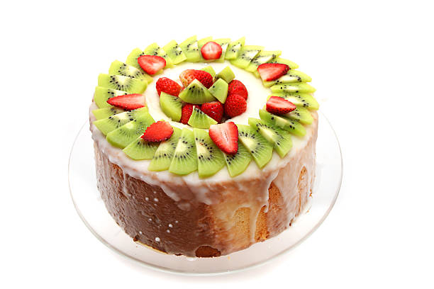 Homemade Angel Food Cake with strawberry and kiwi fruits isolated on white background