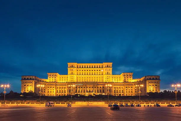 Evening view of the Palace of the Parliament, also known as the People's House, the seat of the Parliament of Romania. The building was completed in 1997 and is the third largest building in the world.