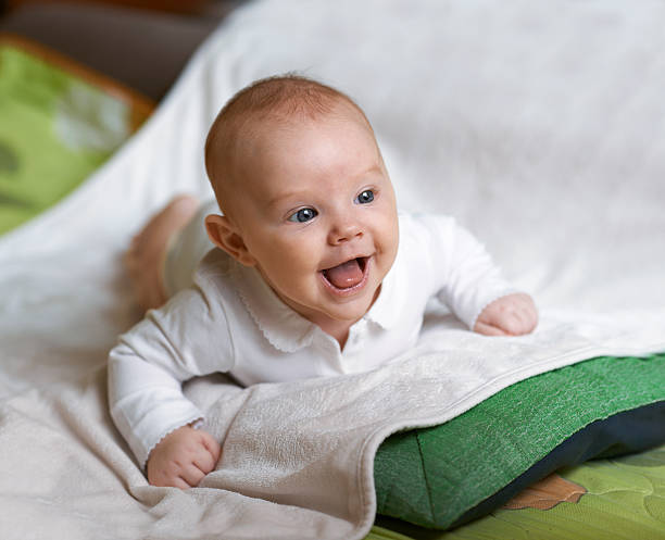 istock cheerful baby lying on his stomach 540492272