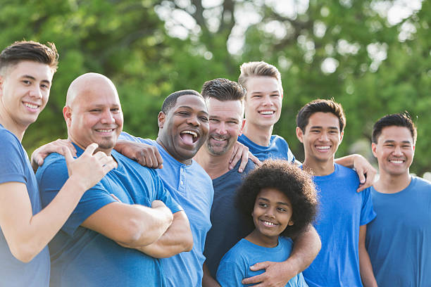 istock Multi-ethnic group of men and sons volunteering 540493112