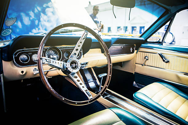 Classic Ford Mustang interior. Benalmadena, Spain - June 21, 2015: Inside view of classic Ford Mustang, in Benalmadena (Spain), on June 21, 2015. vintage steering wheel stock pictures, royalty-free photos & images