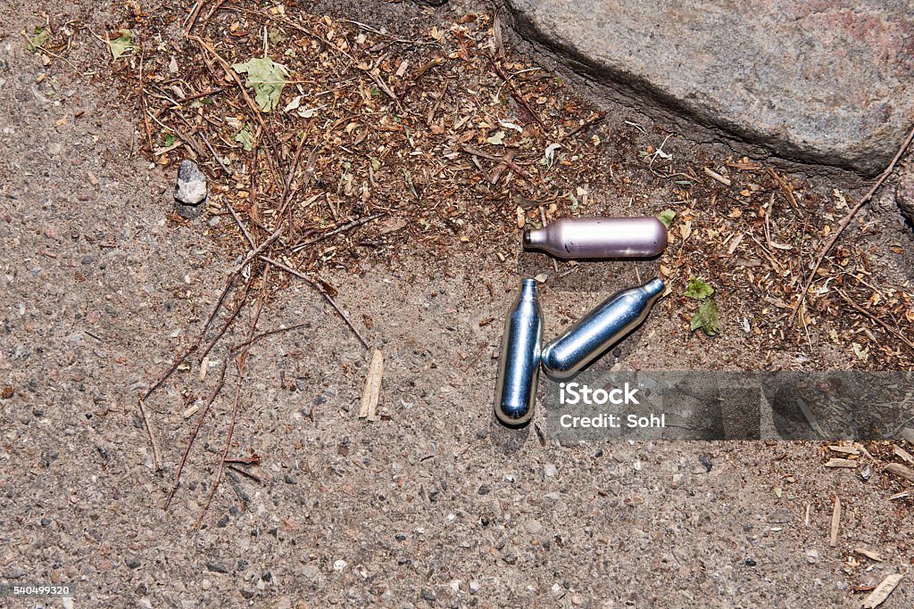 Laughing gas from above N2O or Dinitrogen monoxide, nitrous oxide, nitrous, legal highs,  Balloon, Canister, Inhaling Canister Stock Photo
