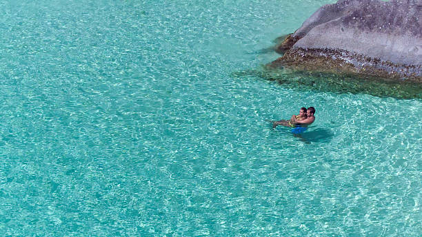 istock attractive couple relaxing at a tropical beach 540501788