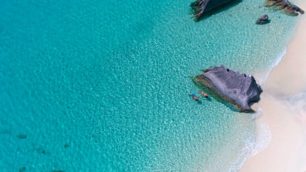istock floating couple on perfect beach in Virgin Gorda, BVI 540501798