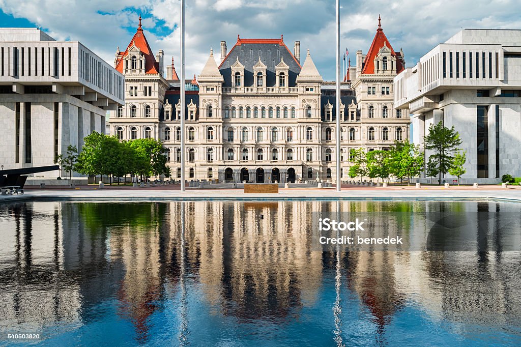 New York State Capitol in Albany New York USA Photo of the New York State Capitol with reflections in a pond. It is the seat of the New York State government, located in downtown Albany, New York, USA. Albany - New York State Stock Photo