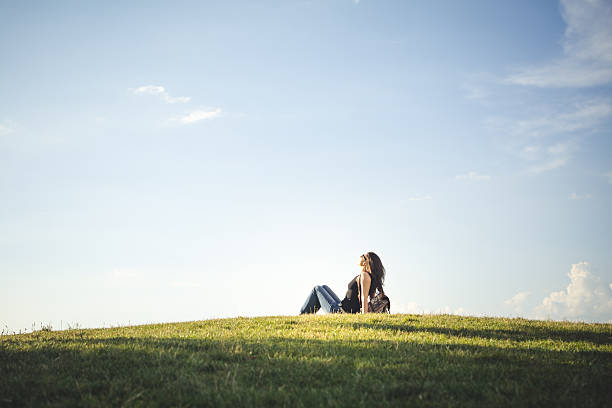 istock Woman lying down in a field 540504164