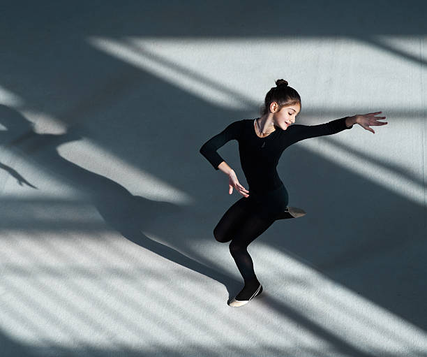 istock girl dancing in  hall rhythmic gymnastics 540505450