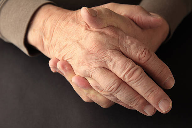 istock Older man holding his numb hand 540505594
