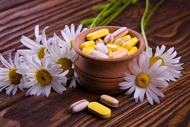 istock Organic pills with camomile 540513122