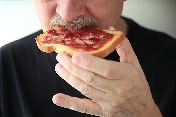istock Toast with jam eaten by man 540513822
