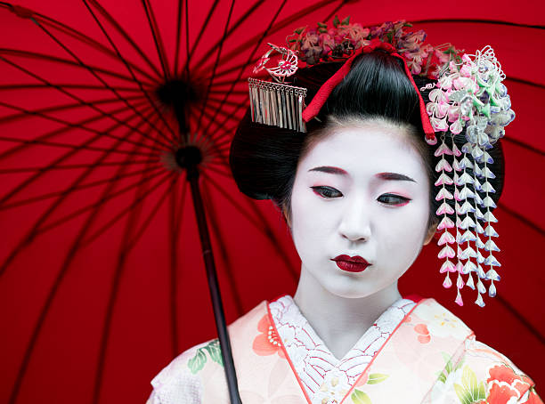 Portrait of a beautiful Geisha looking serious - Japanese culture concepts