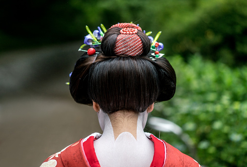Beautiful neck of a Geisha in full Japanese clothing and decorated with traditional makeup and hairdo