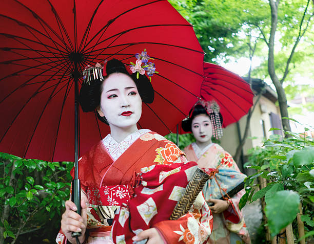 istock Geishas walking outdoors wearing kimonos 540514322