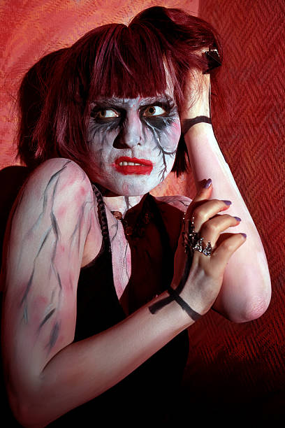 istock zombie girl with painted face in horror 540516472