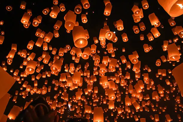 Loy Krathong festival in Chiangmai.Traditional monk Lights floating balloon made of paper annually at temple
