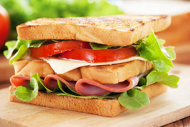istock ham sandwich on wooden board 540520050