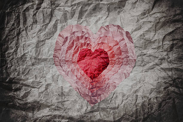 istock Crumpled paper texture with cut as heart shape 540520134