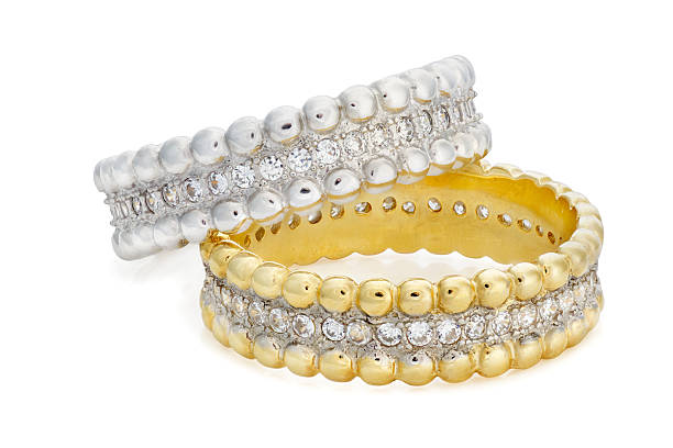 istock Two rings made of  gold and a silver with diamonds 540521354