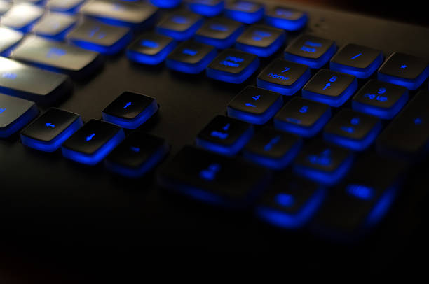 istock Black luminous keyboard. Illuminated computer keys close up view 540521550